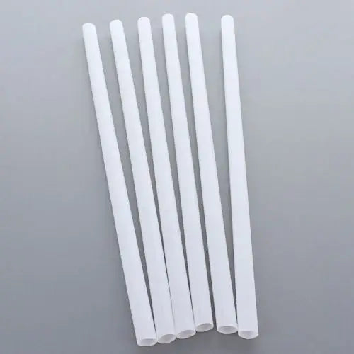 White plastic smoothie straws arranged in a row for eco-friendly drinking solutions