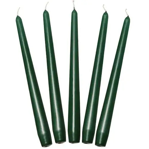 Five dark green taper candles in a row for elegant dinner settings