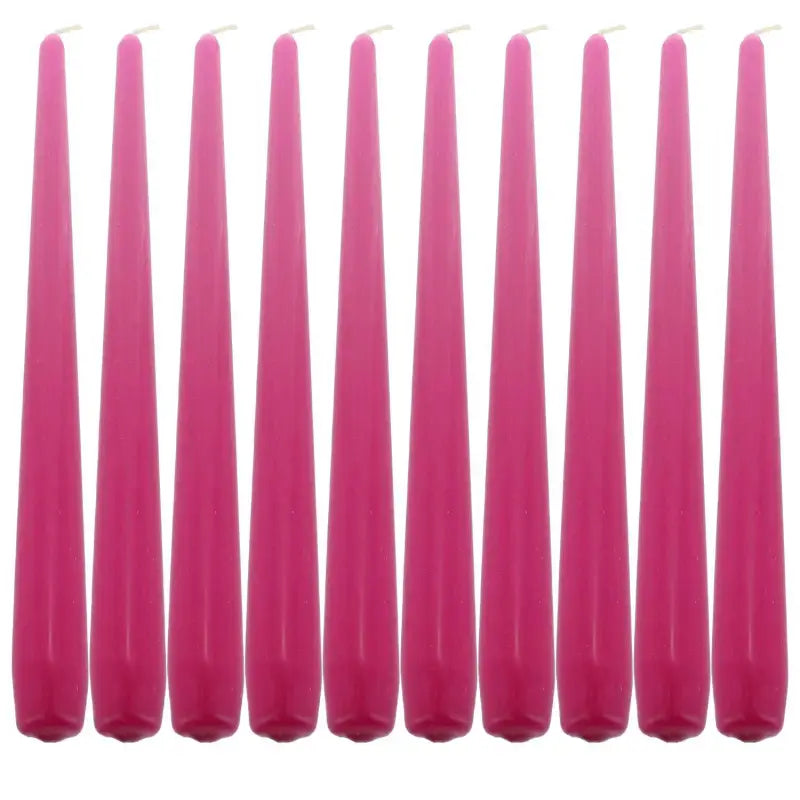 Row of tall pink taper dinner candles for elegant table settings and ambiance