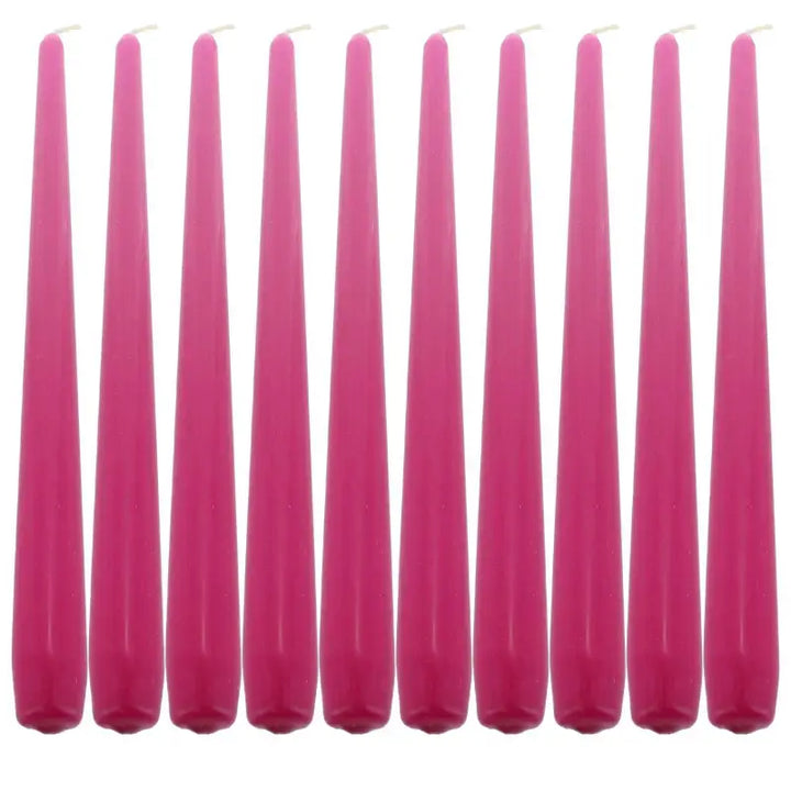 Row of tall pink taper dinner candles for elegant table settings and ambiance