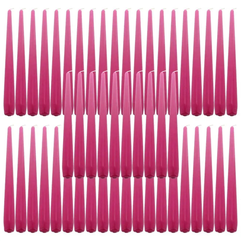 Pink taper dinner candles arranged in rows, perfect for elegant table settings