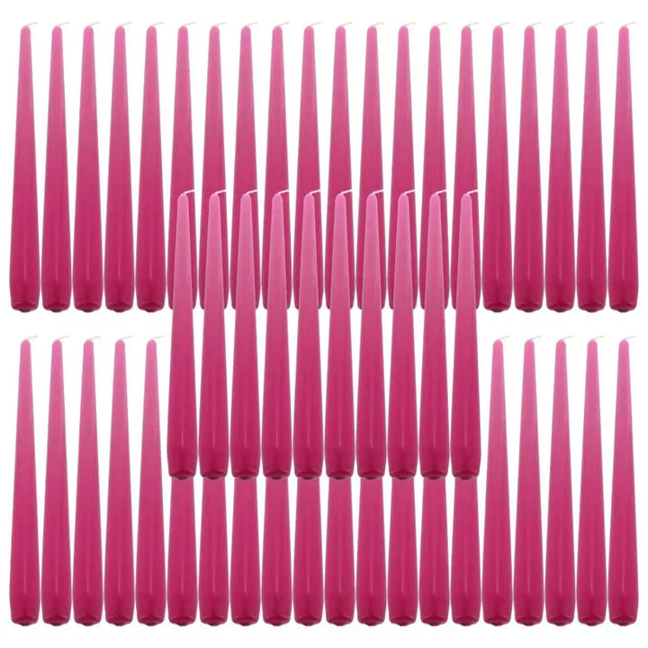 Pink taper dinner candles arranged in rows, perfect for elegant table settings