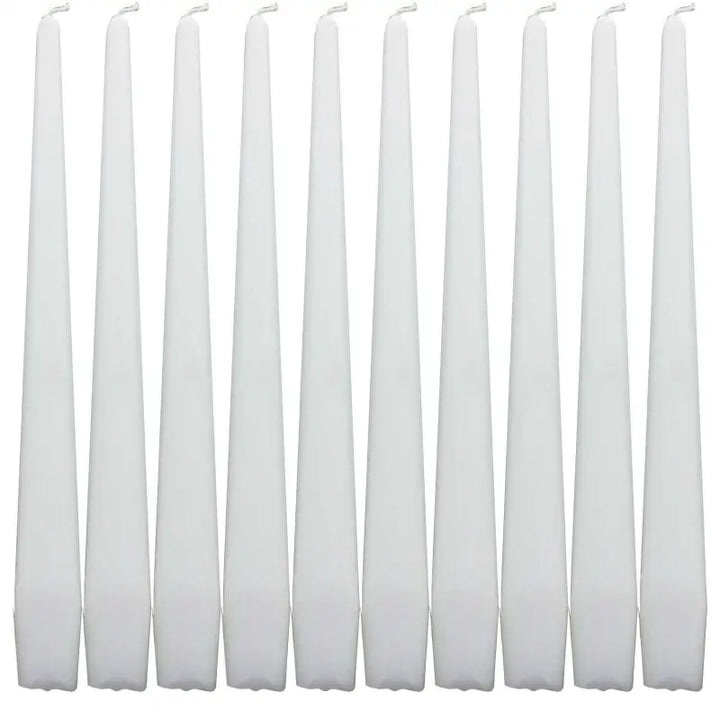 Set of white taper dinner candles arranged in a row for elegant dining decor