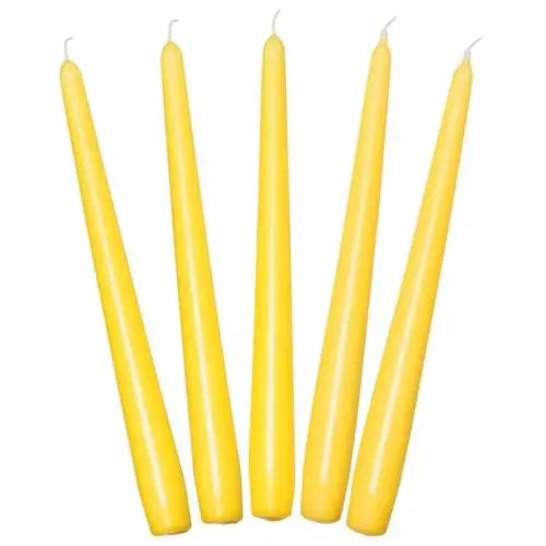 Five yellow taper dinner candles arranged in a row for elegant table decor