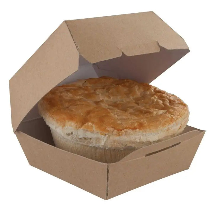 Flaky golden pie in open cardboard clam shell burger packaging