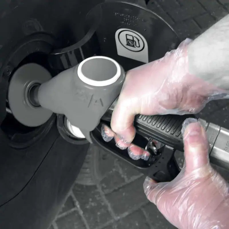 Fuel pump nozzle inserted into vehicle tank, showcasing Clear Embossed Polythene Disposable Gloves