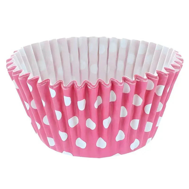 Pink polka dot cupcake cases with white interior and ruffled edges for baking delights