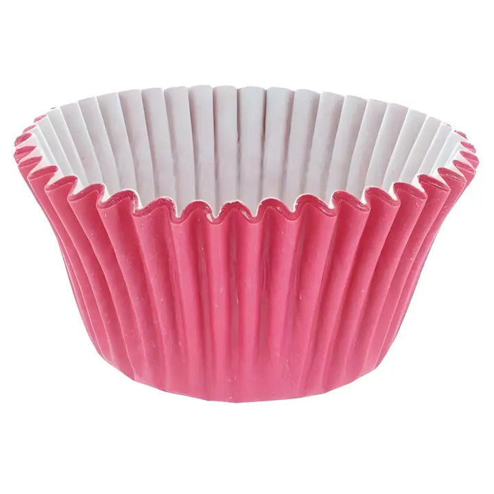 Pink cupcake cases with white interior and fluted edges for baking delights