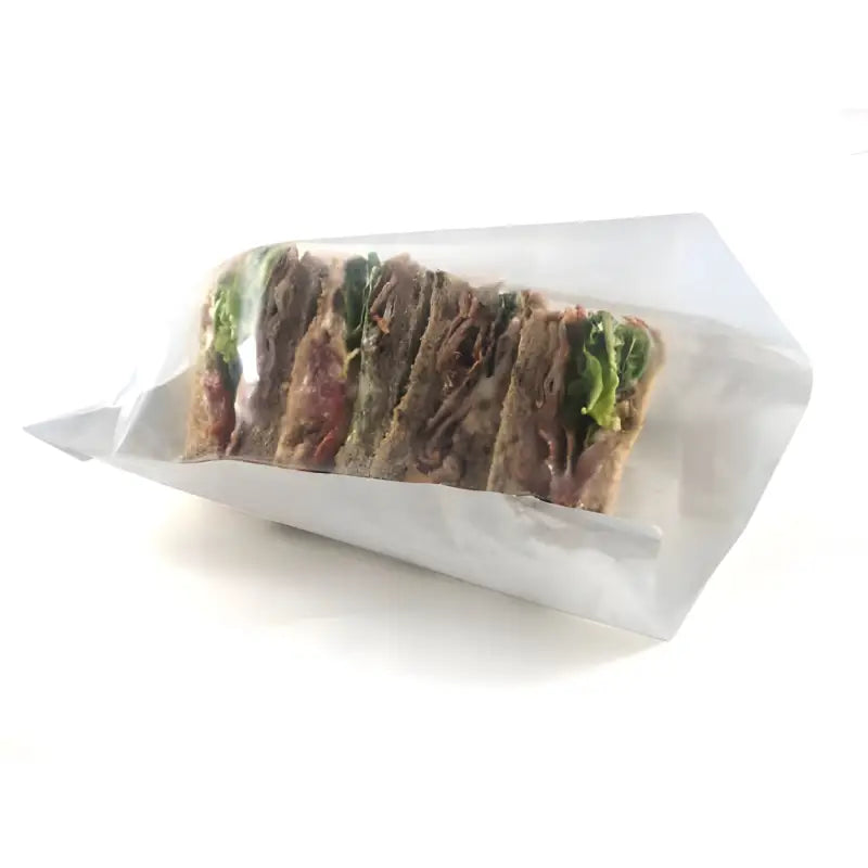 Club sandwich wrapped in film fronted paper bags for fresh food presentation