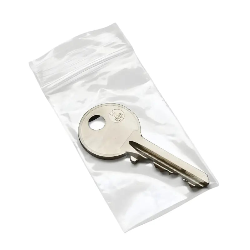 Metal key in a clear plastic zip-lock bag showcasing Grip Seal Bags UK product