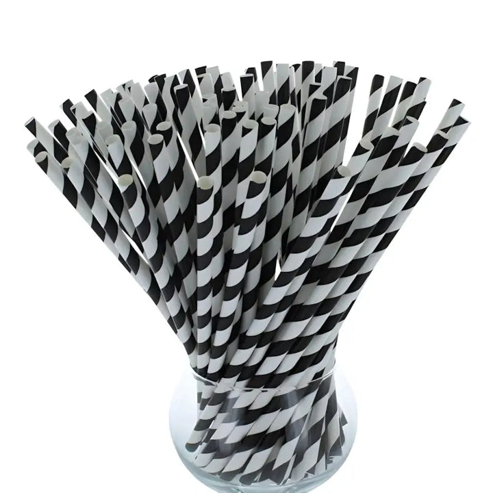 Bundle of black and white paper straws 200mm x 6mm in clear container for vibrant drinks