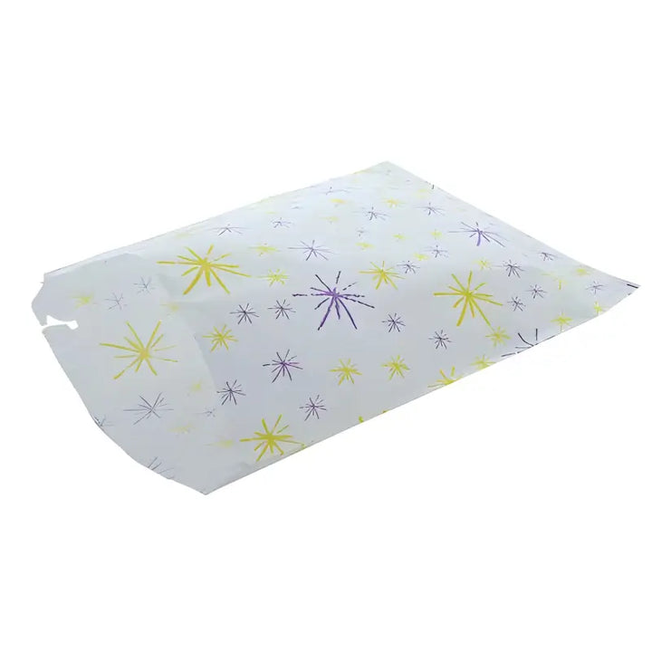 Paper tray liner with yellow and purple starburst decorations for printed sulphite paper bags