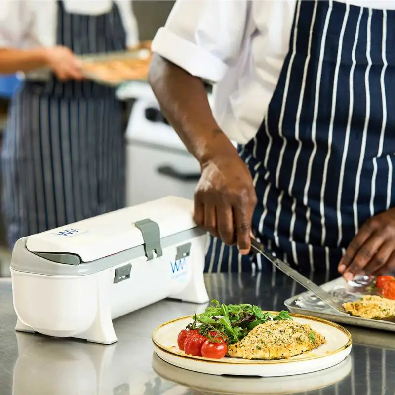 White electric food warmer on a kitchen counter with Wrapmaster 3000 Aluminium Foil 24C54