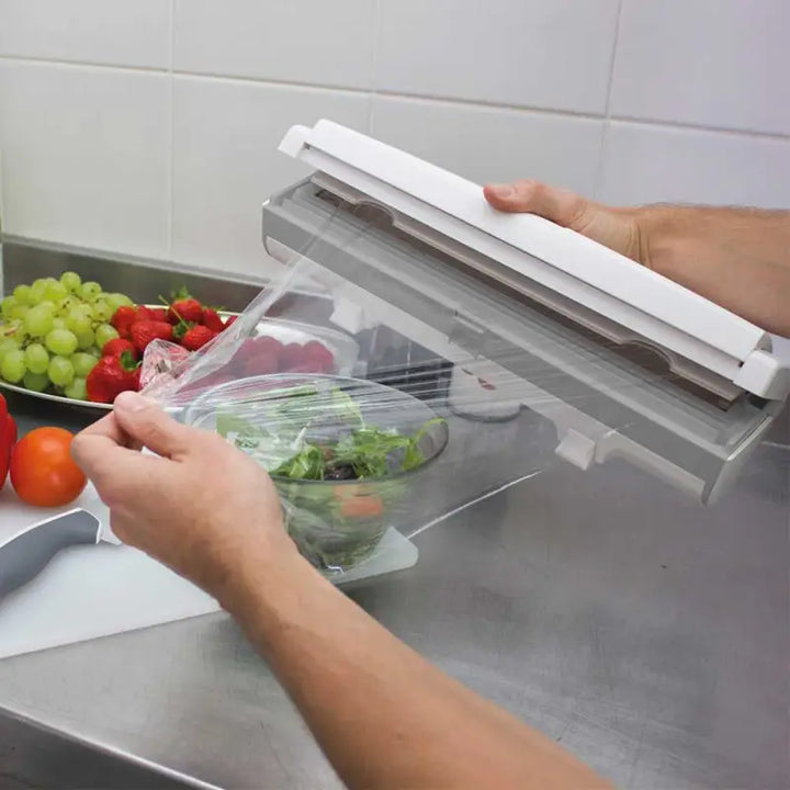 Food vacuum sealer using Wrapmaster Compact Dispenser 63M15 for sealing salad containers